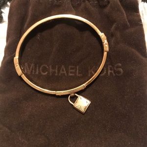 Michael Kors gold lock bracelet with diamonds.